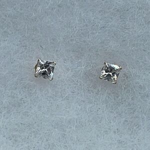 14K JCM CZ stud earrings.